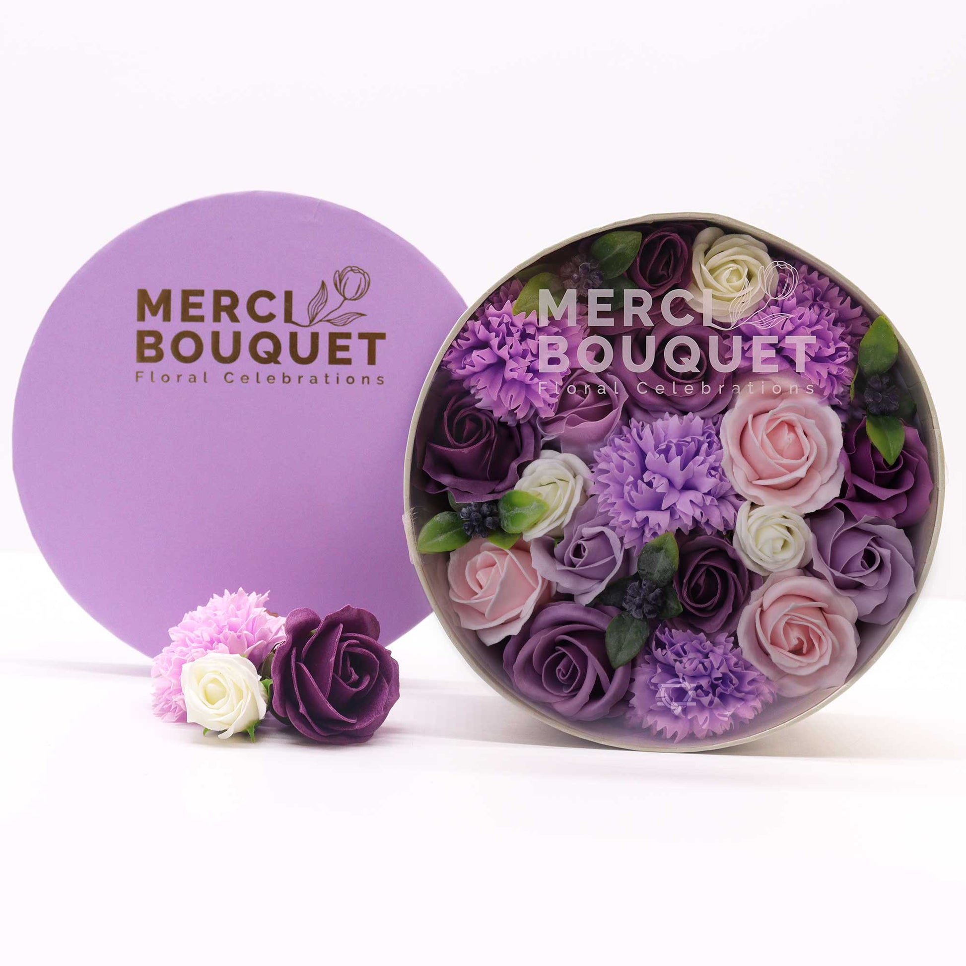 Indulge in the allure of royalty with a Soap Flower Gift Round Box in Lavender Rose &amp; Carnation. This enchanting gift set combines the regal shade of purple with the timeless elegance of roses and carnations.