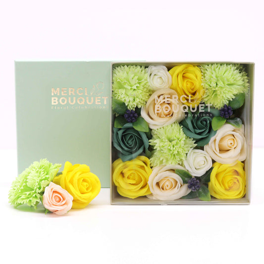 Embrace the beauty of spring all year round with a Soap Flower Gift Square Box in a delightful blend of yellows and greens. This exquisite gift set captures the essence of blooming gardens and the vibrancy of the season.