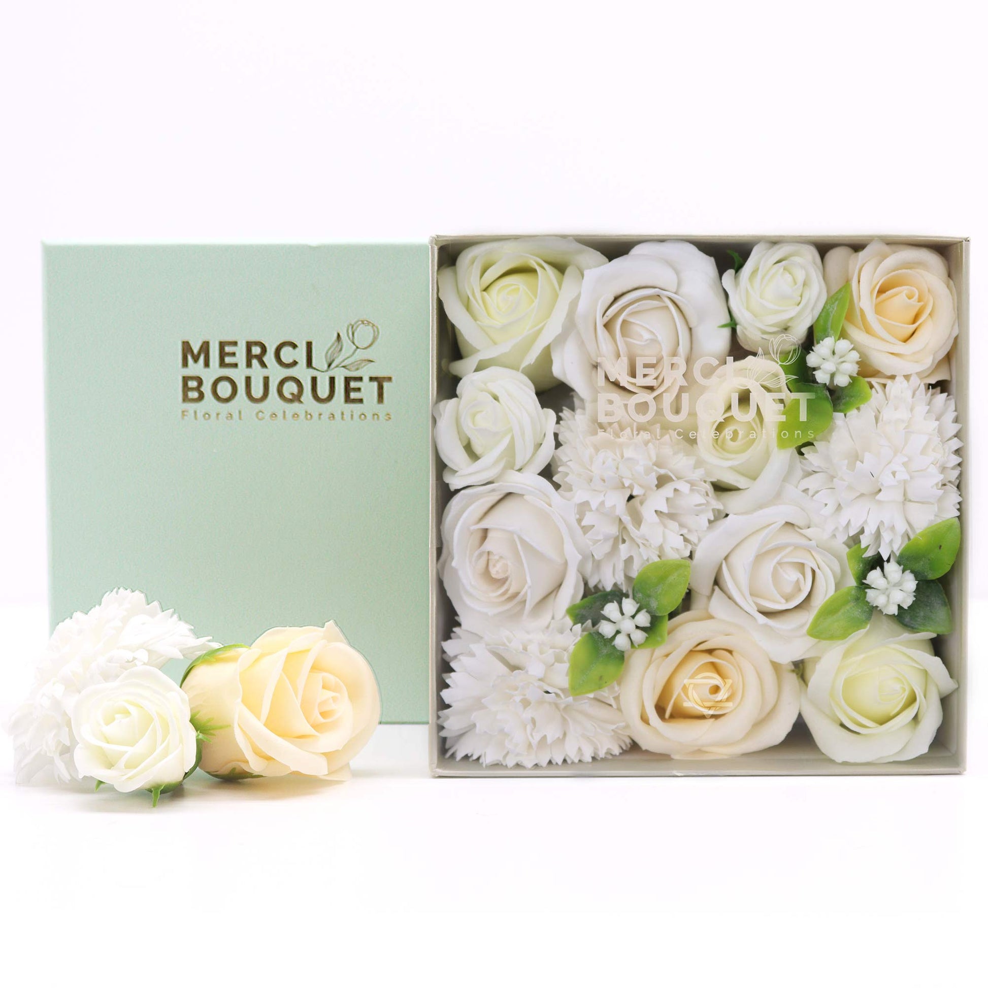 Make your gift-giving an unforgettable experience with Soap Flowers Square Box, in the exquisite "Wedding Blessings - White &amp; Ivory" collection. Crafted with meticulous attention to detail, each soap petal embodies a blend of artistry and quality that sets it apart.